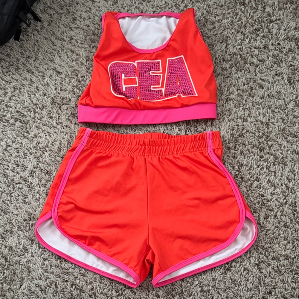 Orange and Pink CEA sports bra with matching shorts